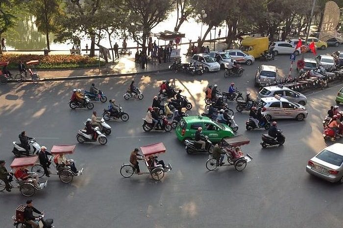 hanoi-vietnam-street-traffic-bicycle-trishaw